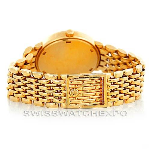 The image shows the back view of a Patek Philippe Calatrava 3998 Men's Yellow Gold Silver Dial 3998 Men's Yellow Gold Silver Dial watch, featuring a gold bracelet and clasp.