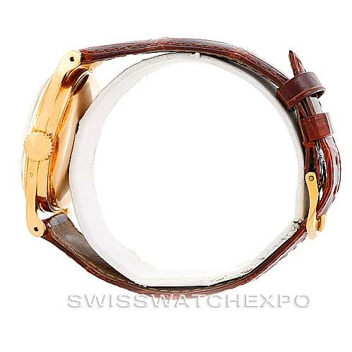 The image shows a side view of the Vintage Patek Philippe watch, showcasing its brown leather strap and gold case profile.