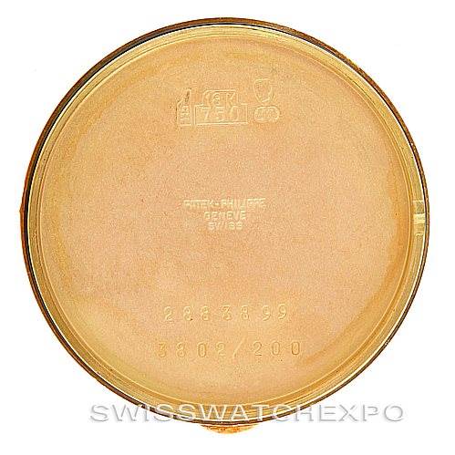 This image shows the inside of the case back of a vintage Patek Philippe watch, displaying various engravings and markings.