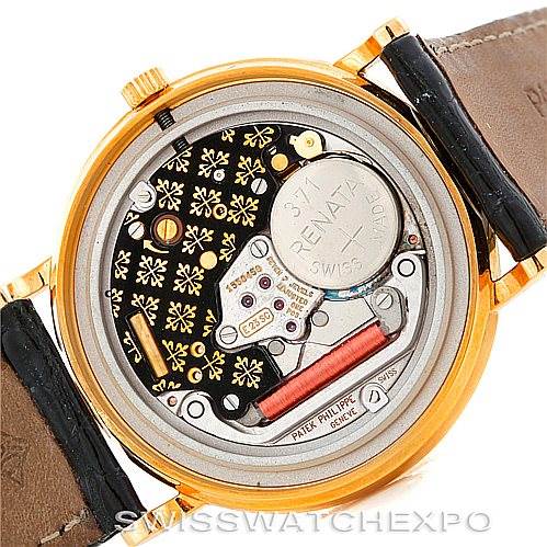 This image shows the case back of a Patek Philippe Calatrava 3944 Men's Yellow Gold White Dial 3944 Men's Yellow Gold White Dial watch, highlighting the intricate internal movement components.