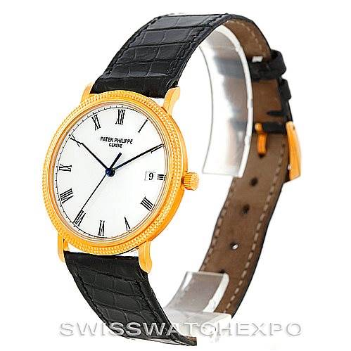 The image shows a side view of the Patek Philippe Calatrava 3944 Men's Yellow Gold White Dial 3944 Men's Yellow Gold White Dial watch displaying the face, bezel, and leather strap.