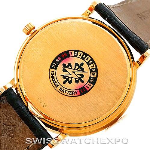The image displays the back case of a Patek Philippe Calatrava 3944 Men's Yellow Gold White Dial 3944 Men's Yellow Gold White Dial watch, highlighting the battery change indicator.