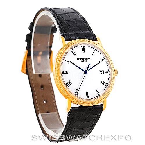 The image shows a Patek Philippe Calatrava 3944 Men's Yellow Gold White Dial 3944 Men's Yellow Gold White Dial watch at a slight diagonal angle, highlighting its face, bezel, and leather strap.