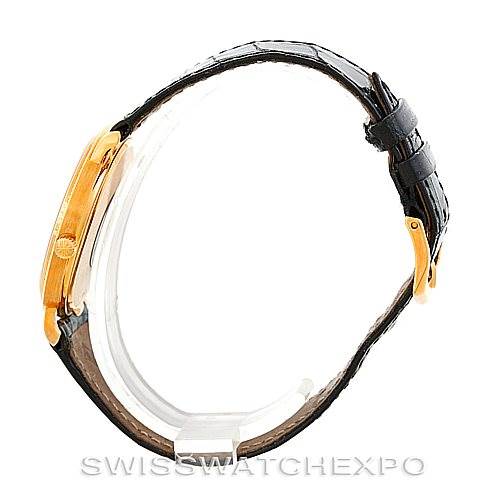 The image displays a side profile of a Patek Philippe Calatrava 3944 Men's Yellow Gold White Dial 3944 Men's Yellow Gold White Dial watch, highlighting its thin case and leather strap.