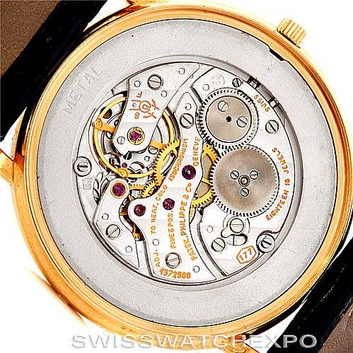 This image shows the back view of a Patek Philippe Calatrava 3520 Men's Yellow Gold White Dial 3520 Men's Yellow Gold White Dial model watch, highlighting its intricate mechanical movement.
