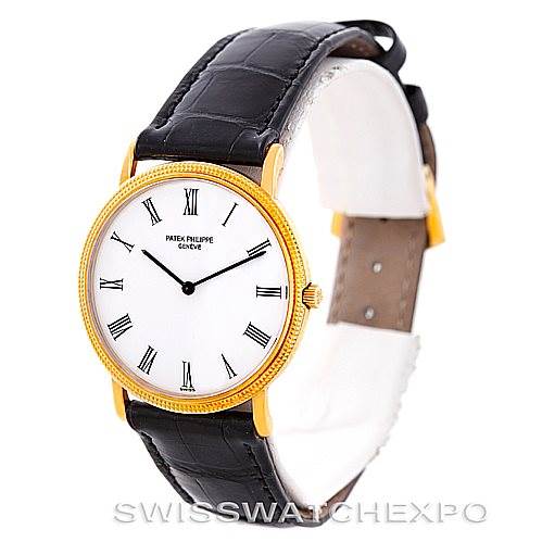The image shows a Patek Philippe Calatrava 3520 Men's Yellow Gold White Dial 3520 Men's Yellow Gold White Dial watch with a white Roman numeral dial, gold case, and black leather strap from a front angle.