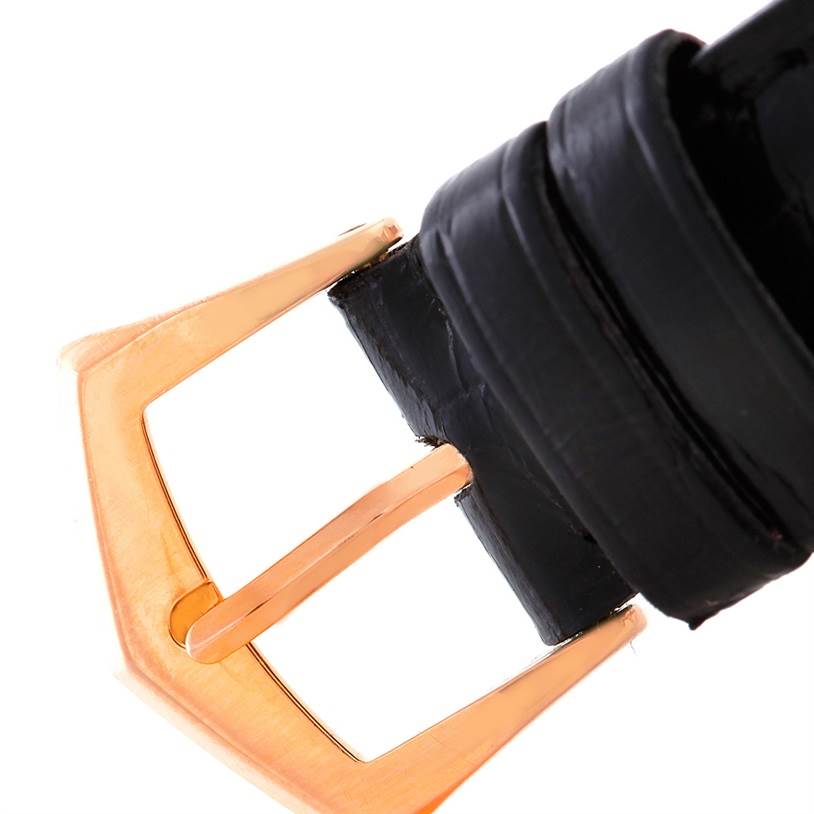 This is a close-up angle of the buckle end of the black leather strap of the Calatrava model by Patek Philippe.