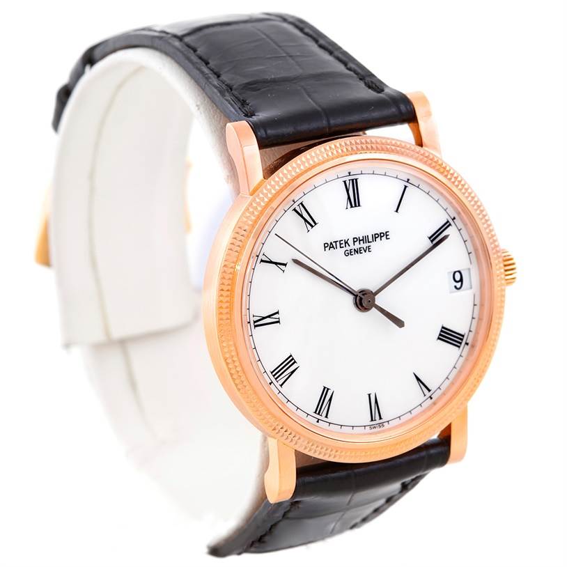 This image shows a Patek Philippe Calatrava 3802 Men's Rose Gold White Dial 3802 Men's Rose Gold White Dial watch angled to display the face, bezel, and part of the black leather strap.