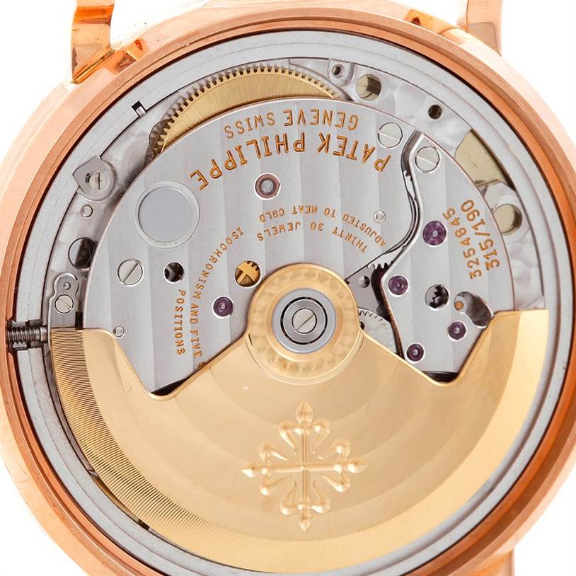 This is a close-up view of the movement of a Patek Philippe Calatrava 3802 Men's Rose Gold White Dial 3802 Men's Rose Gold White Dial watch, showing intricate mechanical parts.