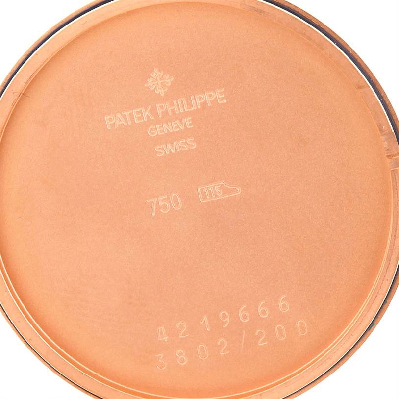 This image shows the interior back cover of a Patek Philippe Calatrava 3802 Men's Rose Gold White Dial 3802 Men's Rose Gold White Dial watch, featuring engravings and serial numbers.