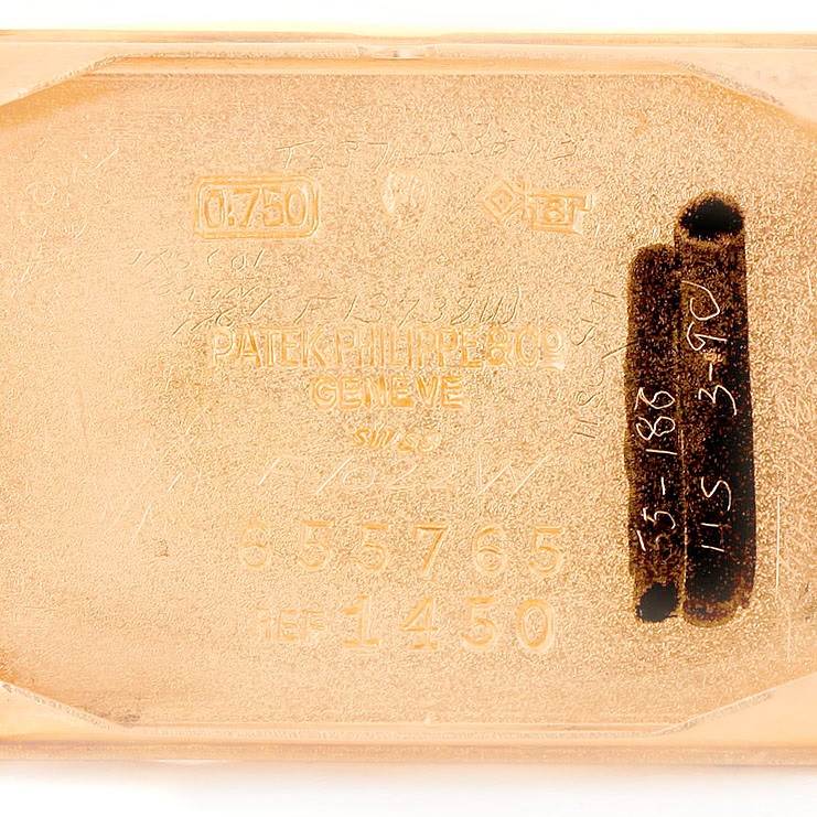 This image shows the engraved back plate of a Vintage Patek Philippe watch, model 1450.