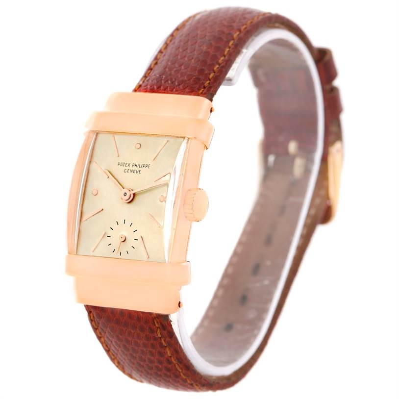 This image shows a Patek Philippe Vintage 1450 Men's Rose Gold Silver Dial 1450 Men's Rose Gold Silver Dial watch at an angled view, highlighting the rectangular dial and brown leather strap.