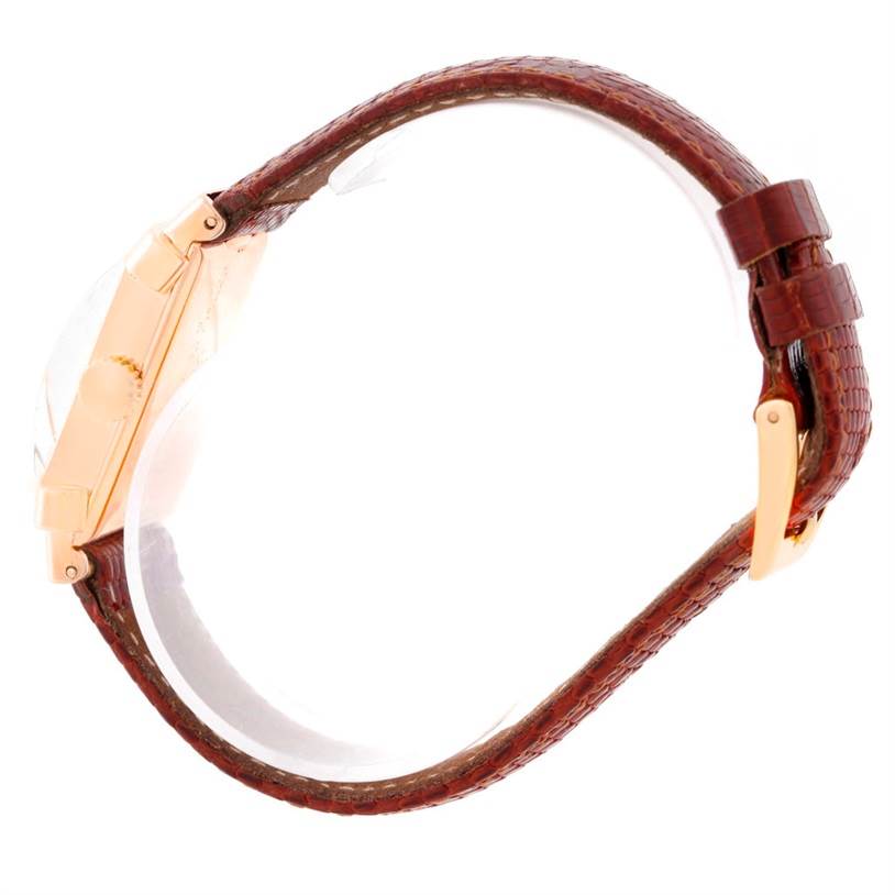 The image shows a side profile of a vintage Patek Philippe watch, highlighting the strap, buckle, and case side.