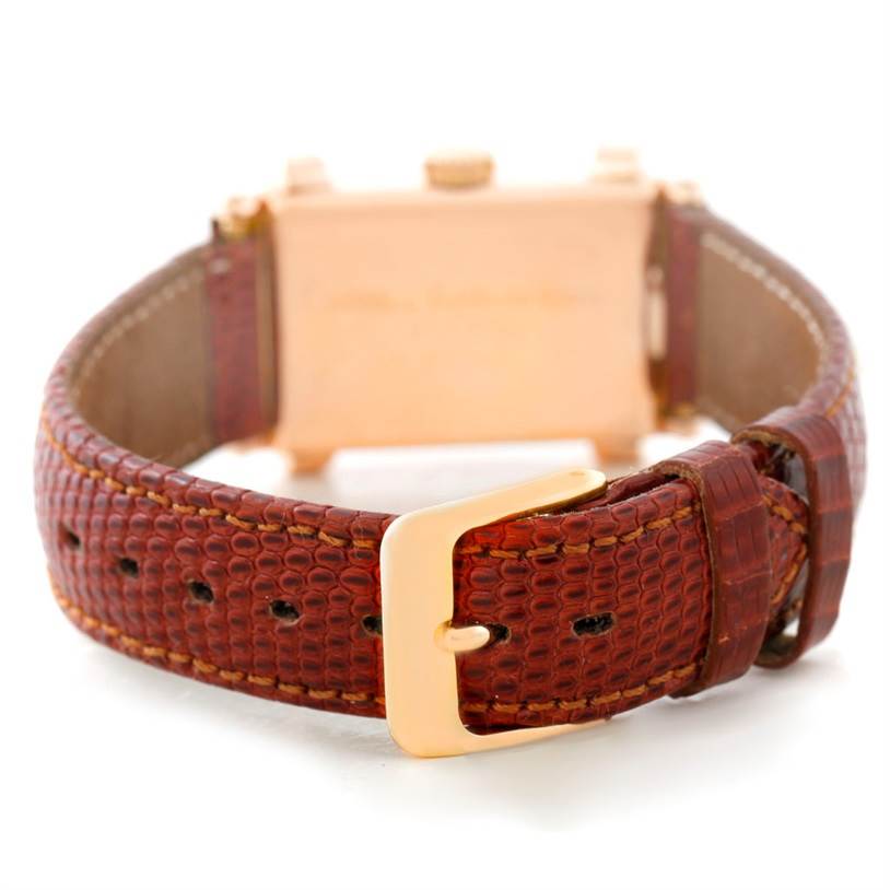 This image shows the back angle of a Vintage Patek Philippe watch, focusing on the leather strap and gold buckle.