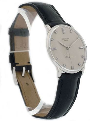 The image shows a side angled view of the Patek Philippe 2573/2 Platinum Silver Dial 2573/2 Platinum Silver Dial Vintage Men Platinum Diamond 2573/2 Rare model watch with its face, strap, and buckle visible.