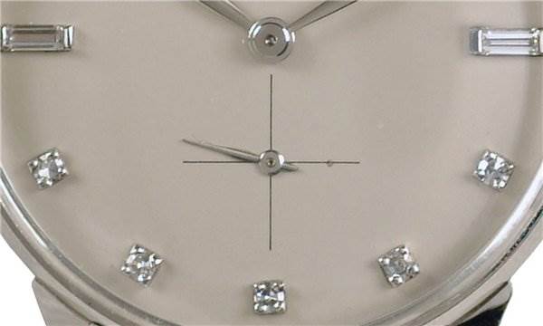 This close-up image shows the dial and hands of the Vintage Men Platinum Diamond 2573/2 Rare model by Patek Philippe 2573/2 Platinum Silver Dial 2573/2 Platinum Silver Dial.