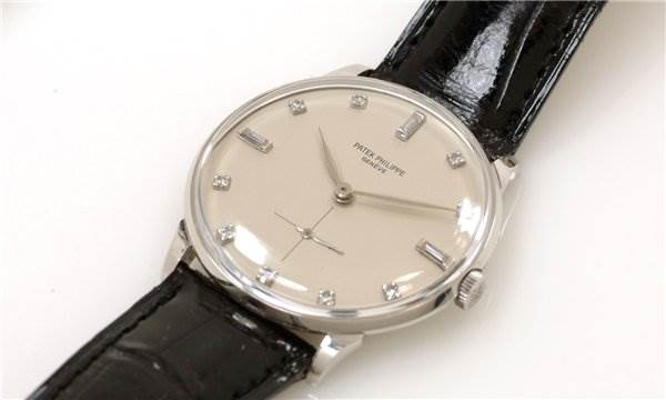 The image shows a close-up view of the watch face and strap of the Patek Philippe 2573/2 Platinum Silver Dial 2573/2 Platinum Silver Dial Vintage Men Platinum Diamond 2573/2 Rare model.