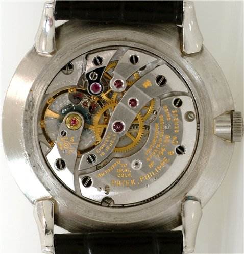 This image shows the back of the Patek Philippe 2573/2 Platinum Silver Dial 2573/2 Platinum Silver Dial Vintage Men Platinum Diamond 2573/2 Rare model, revealing the watch's internal mechanism.
