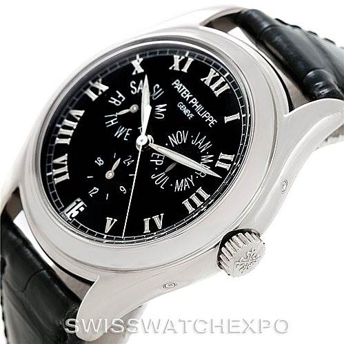 The image shows a side angle of the Patek Philippe 5035G Men's White Gold Black Dial 5035G Men's White Gold Black Dial Complicated Annual Calendar Mens Watch 5035G, highlighting the dial and crown.