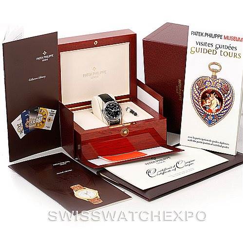 The image shows a Patek Philippe 5035G Men's White Gold Black Dial 5035G Men's White Gold Black Dial Complicated Annual Calendar Men's Watch 5035G in its box, with accessories and brochures displayed around it.