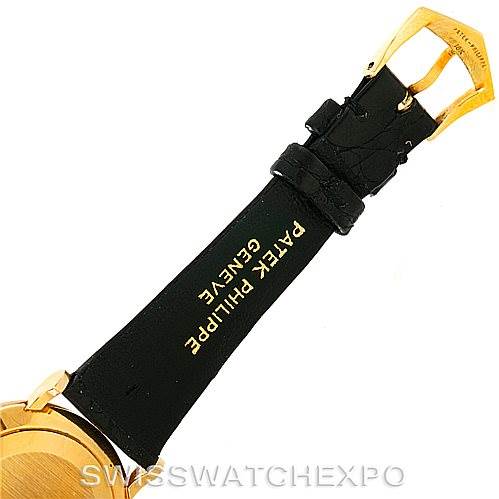 This image shows the buckle and part of the strap of a Patek Philippe Calatrava 3919 Men's Yellow Gold White Dial 3919 Men's Yellow Gold White Dial model watch from an angle focusing on the strap and clasp.