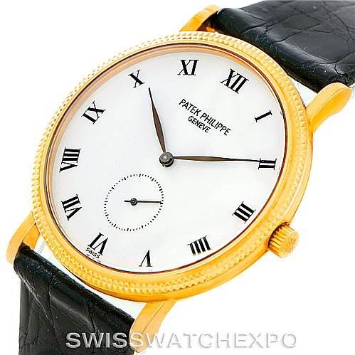 The image displays a Patek Philippe Calatrava 3919 Men's Yellow Gold White Dial 3919 Men's Yellow Gold White Dial model watch, showing the face, crown, and part of the black leather strap at a slight angle.