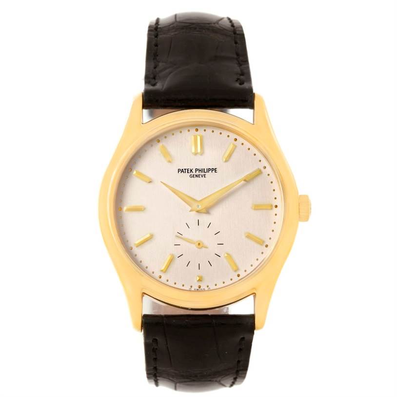 This image shows a Patek Philippe Calatrava 5023 Men's Yellow Gold Silver Dial 5023 Men's Yellow Gold Silver Dial watch, viewed from the front, featuring a gold case, leather strap, and silver dial.