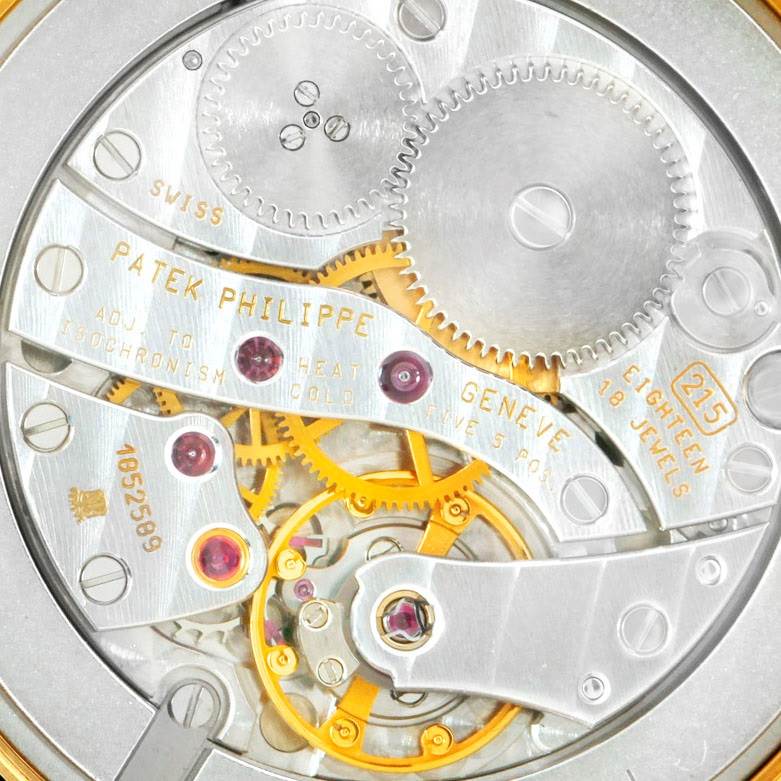 This is a close-up image showing the inner mechanical movement of the Patek Philippe Calatrava 5023 Men's Yellow Gold Silver Dial 5023 Men's Yellow Gold Silver Dial watch.