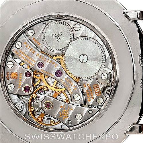 The image shows the back view of the movement of a Patek Philippe Calatrava 5119G Men's White Gold White Dial 5119G Men's White Gold White Dial watch, displaying the intricate mechanical components.