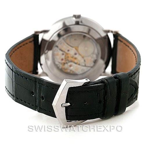 The image shows the back view of a Patek Philippe Calatrava 5119G Men's White Gold White Dial 5119G Men's White Gold White Dial watch, highlighting the transparent case back and black leather strap.