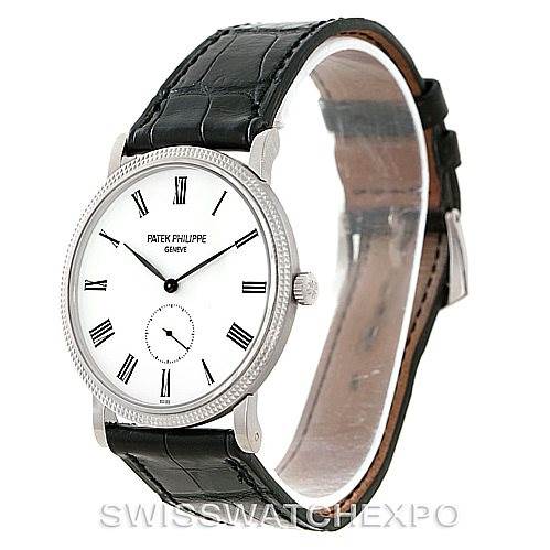 The Patek Philippe Calatrava 5119G Men's White Gold White Dial 5119G Men's White Gold White Dial watch is shown at a slight angle, highlighting its face, bezel, crown, and leather strap.