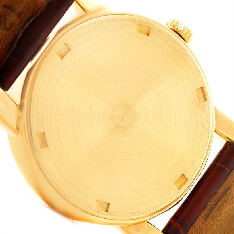 This image shows the back case of a Patek Philippe Calatrava 5012 Men
s Yellow Gold Beige Dial 5012 Men
s Yellow Gold Beige Dial watch from a top-down angle.
