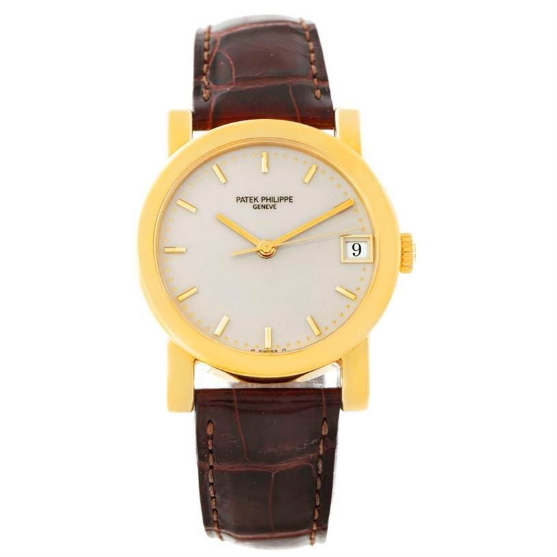 The image shows a front view of the Patek Philippe Calatrava 5012 Men
s Yellow Gold Beige Dial 5012 Men
s Yellow Gold Beige Dial watch, highlighting its golden case, cream dial, and brown leather strap.