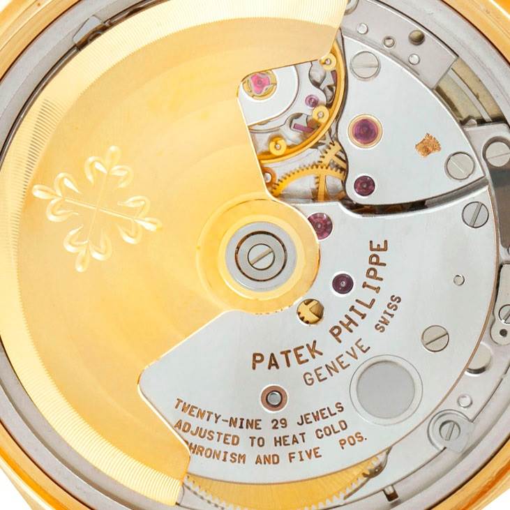 This image shows the intricate rear movement and mechanism of a Patek Philippe Calatrava 5012 Men
s Yellow Gold Beige Dial 5012 Men
s Yellow Gold Beige Dial watch.