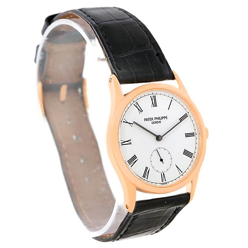 The image shows a Patek Philippe Calatrava 3796R Men
s Rose Gold White Dial 3796R Men
s Rose Gold White Dial watch from an oblique angle, displaying the face, bezel, and strap.