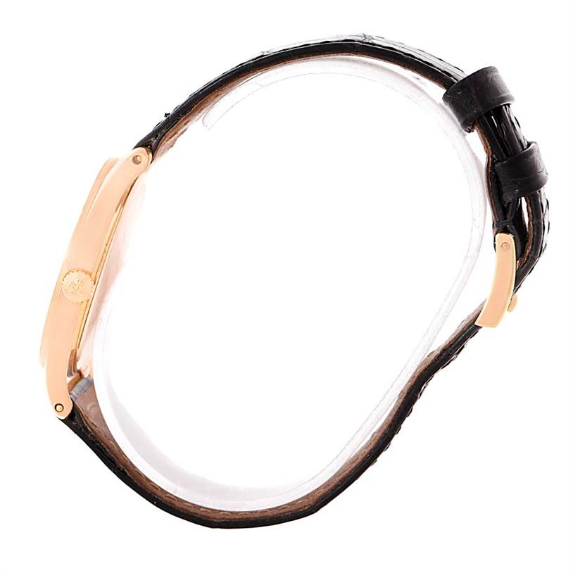 The image displays a side view of the Calatrava model by Patek Philippe, showing its strap and clasp.