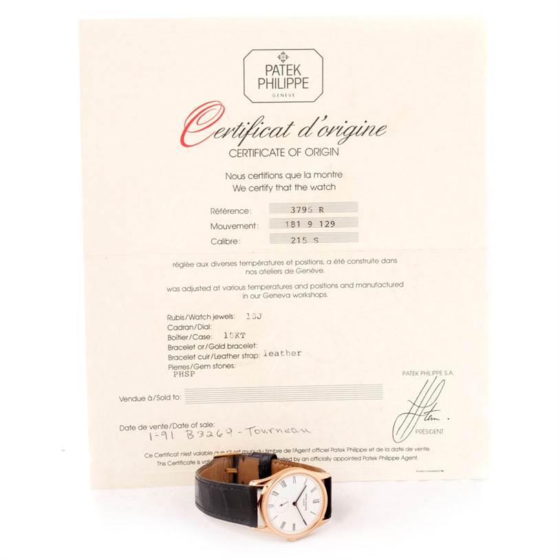 The image shows a Patek Philippe Calatrava 3796R Men
s Rose Gold White Dial 3796R Men
s Rose Gold White Dial watch at a side angle, accompanied by its certificate of origin in the background.