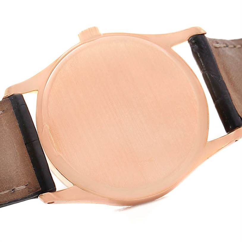 The image shows the back case and leather strap of a Patek Philippe Calatrava 3796R Men
s Rose Gold White Dial 3796R Men
s Rose Gold White Dial watch.