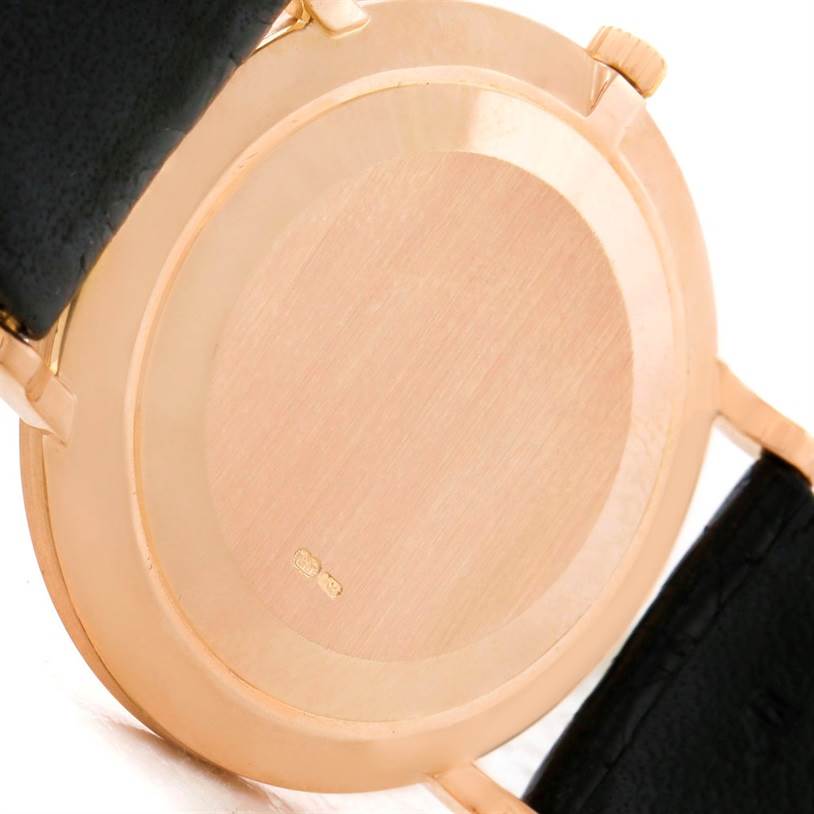 The image shows the case back and part of the strap of a Patek Philippe Calatrava 3919 Men
s Rose Gold White Dial 3919 Men
s Rose Gold White Dial watch, viewed from the rear.