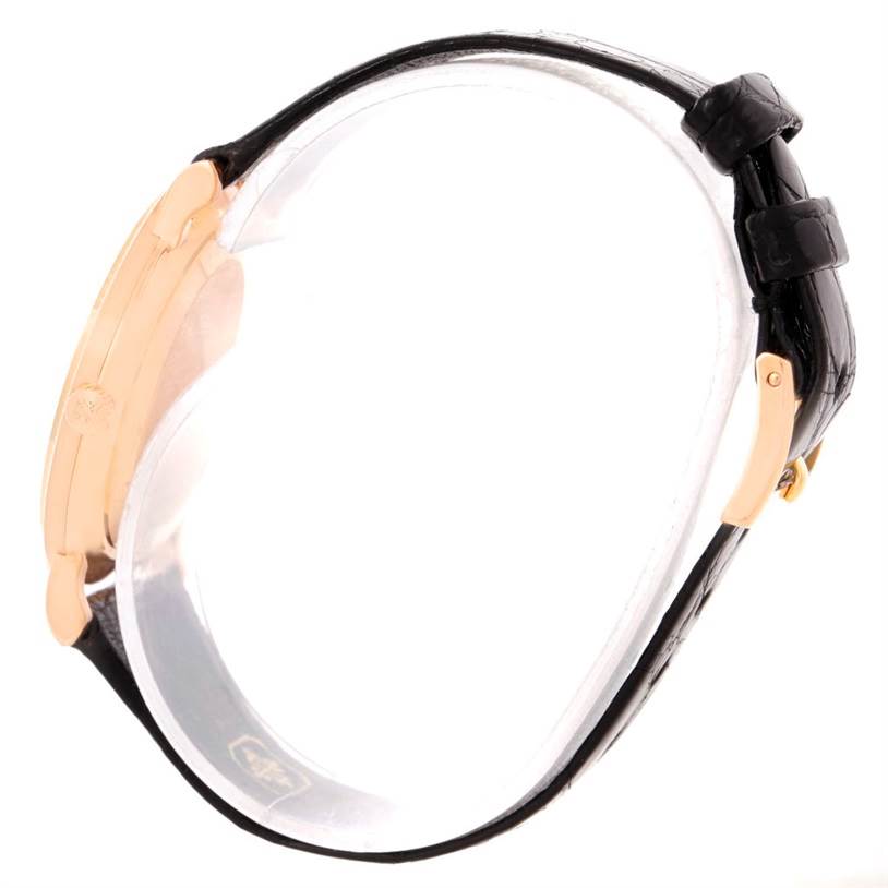 The image shows a side view of a Patek Philippe Calatrava 3919 Men
s Rose Gold White Dial 3919 Men
s Rose Gold White Dial watch, highlighting the case and strap.