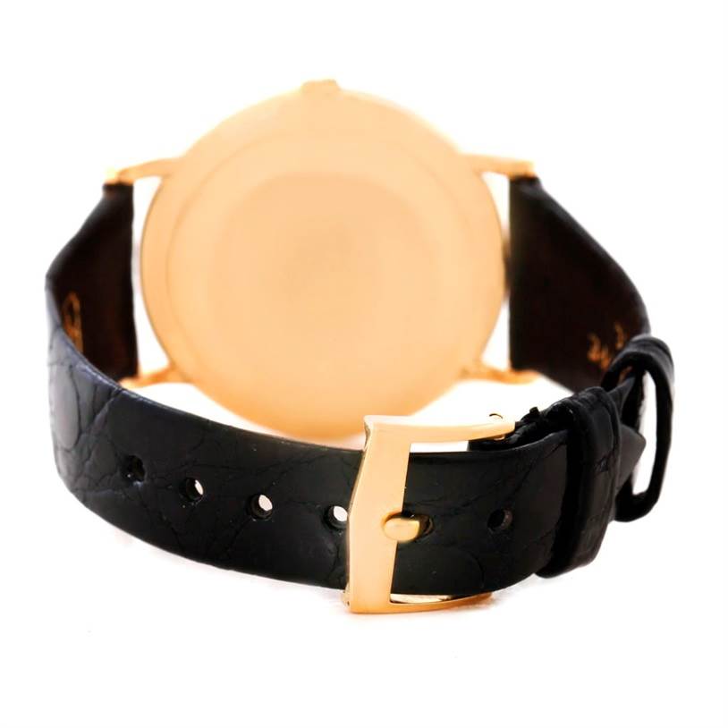 This image shows the back view of a Patek Philippe Calatrava 3919 Men
s Rose Gold White Dial 3919 Men
s Rose Gold White Dial watch, highlighting its leather strap and buckle.