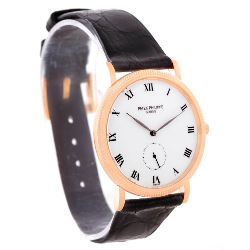 This image shows a Patek Philippe Calatrava 3919 Men
s Rose Gold White Dial 3919 Men
s Rose Gold White Dial watch at a slight angle, highlighting its face, Roman numerals, and black leather strap.
