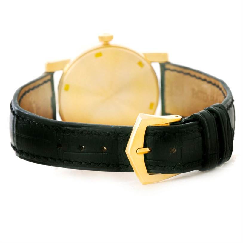 The image shows the backside and strap of a Patek Philippe Calatrava 5012 Men
s Yellow Gold Beige Dial 5012 Men
s Yellow Gold Beige Dial watch, highlighting the buckle and leather band.