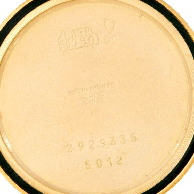 This image shows the inner back cover of a Patek Philippe Calatrava 5012 Men
s Yellow Gold Beige Dial 5012 Men
s Yellow Gold Beige Dial watch model, with hallmarks and serial numbers visible.