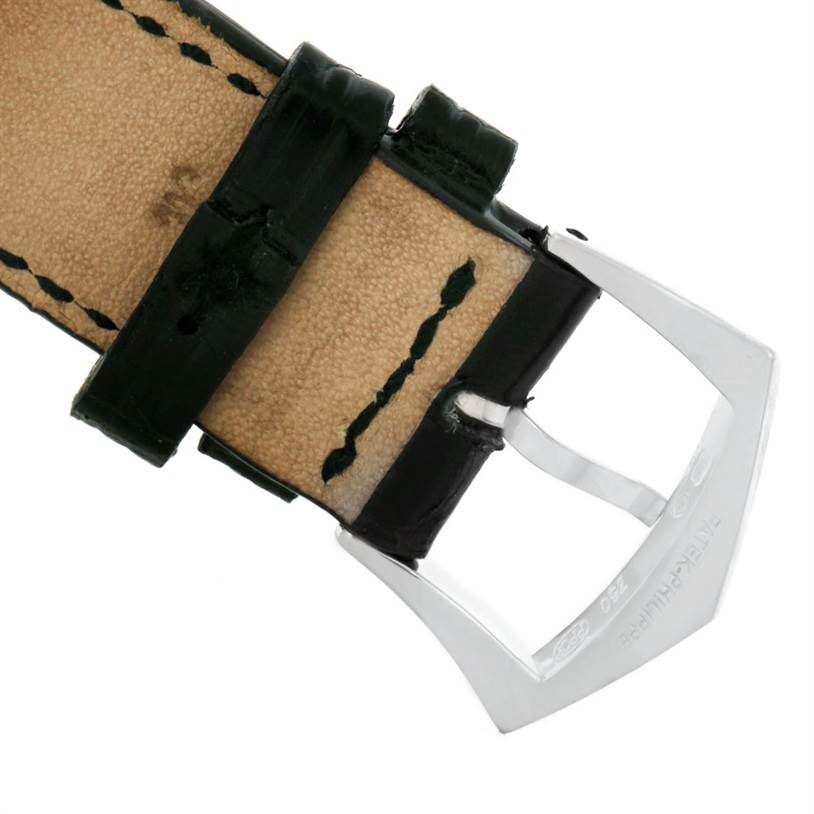 This image shows the buckle and part of the leather strap of a Patek Philippe Calatrava 5120 Men's White Gold White Dial 5120 Men's White Gold White Dial watch from a close-up angle.