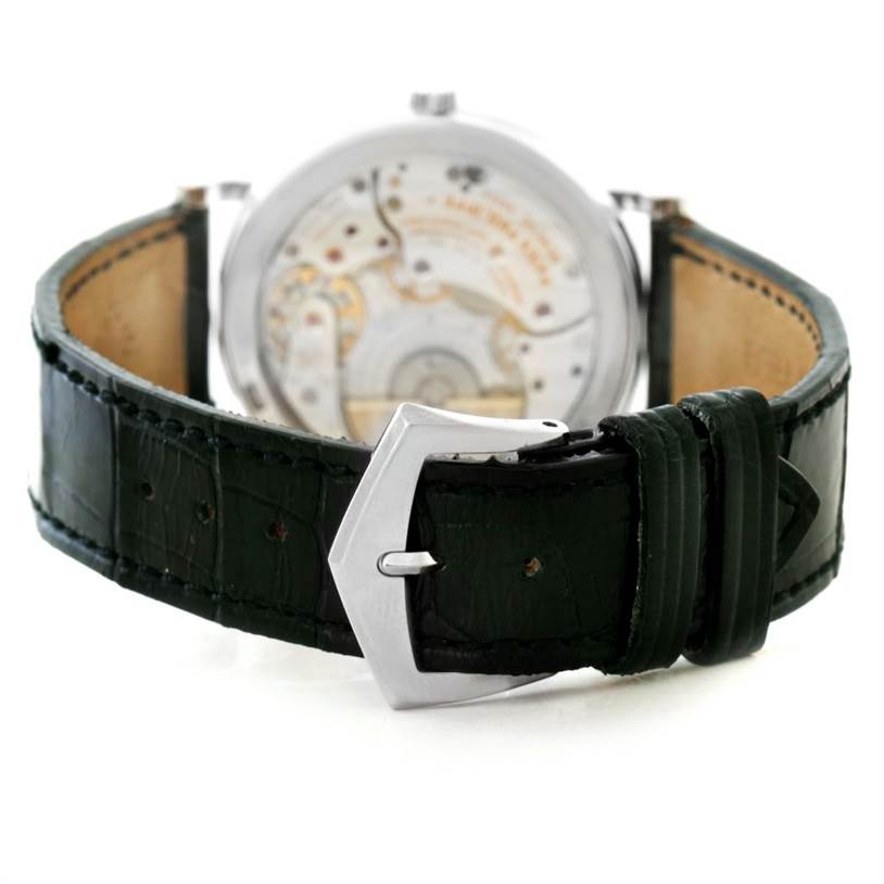 This image shows the back of a Patek Philippe Calatrava 5120 Men's White Gold White Dial 5120 Men's White Gold White Dial watch and its leather strap with close-up of the buckle.