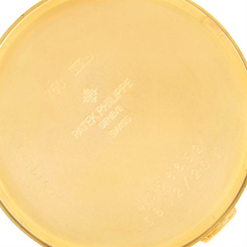 The image shows the interior case back of a Patek Philippe Calatrava 3802 Men's Yellow Gold White Dial 3802 Men's Yellow Gold White Dial watch, highlighting engravings and hallmarks.