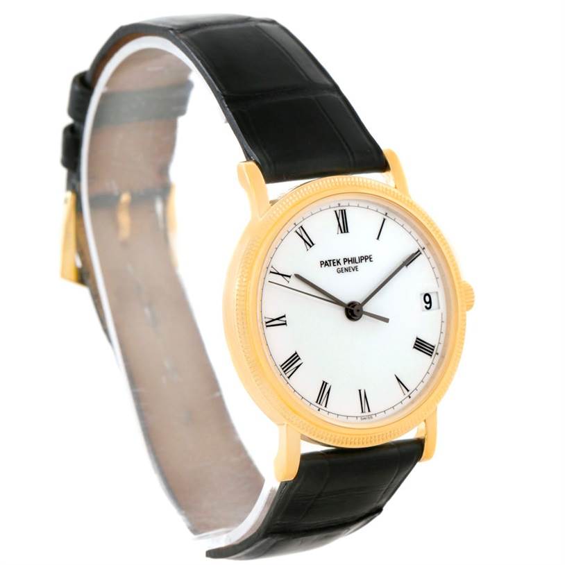 The image shows a side angle of a Patek Philippe Calatrava 3802 Men's Yellow Gold White Dial 3802 Men's Yellow Gold White Dial watch, highlighting its face, strap, and case.