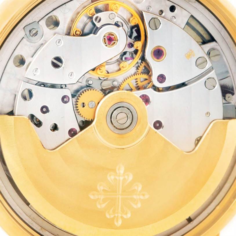 The image shows the intricate movement and internal mechanical parts of a Patek Philippe Calatrava 3802 Men's Yellow Gold White Dial 3802 Men's Yellow Gold White Dial watch from a close-up, rear angle.