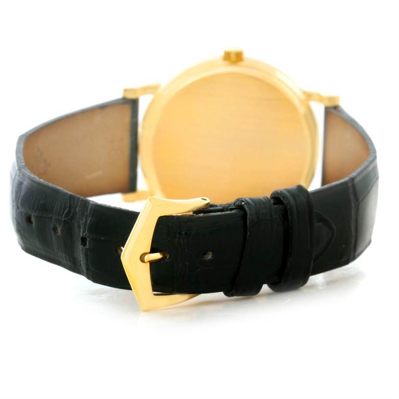 This image shows the back and strap of a Patek Philippe Calatrava 3802 Men's Yellow Gold White Dial 3802 Men's Yellow Gold White Dial watch at an angle, highlighting the buckle and leather band.